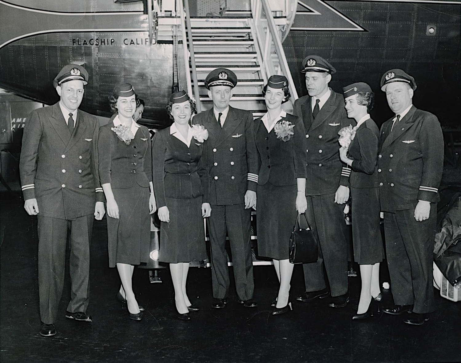  American Airlines' inaugural flight crew with Boeing 707 Flagship California, at LAX, 25 January 1959. Left to right: Flight Engineer Norman Rice, Stewardess Marilyn Rutkowski, Stewardess Edna Garrett, Captain Charles Macatee, Stewardess Argie Hoskins, Captain Lou Szabo, Stewardess Claire Bullock, Flight Engineer Bill Duncan. (American Airlines photograph via Miss Argie Hoskins' AMERICAN AIRLINES 707 JET STEWARDESS)