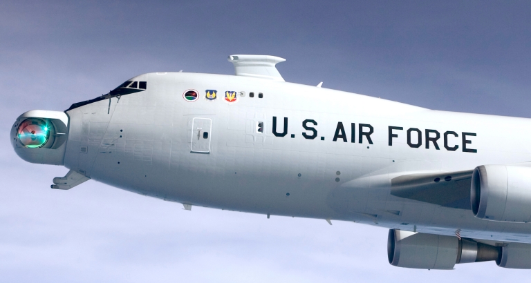 Boeing YAL-1A 00-0001, Airborne Laser test aircraft, in flight. The laser aiming turret is directed toward the photo aircraft. (U.S. Air Force)