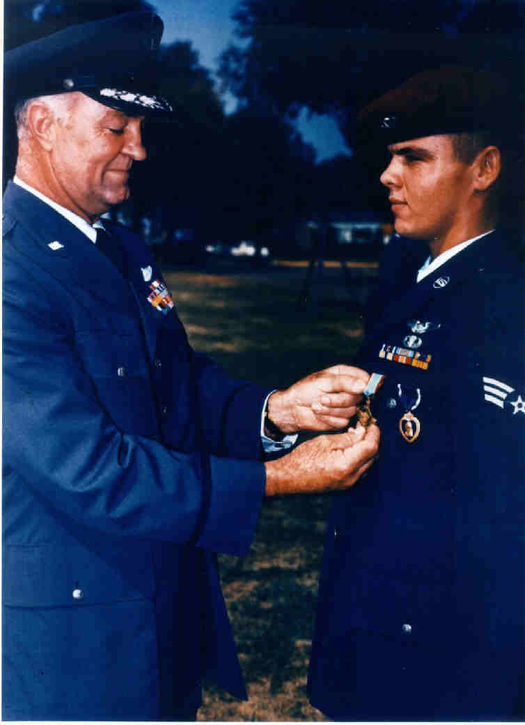 General Howell M. Estes, Jr., presents the Air Force Cross to Airman 1st Class Duane D. Hackney, 9 September 1967. (U.S. Air Force)