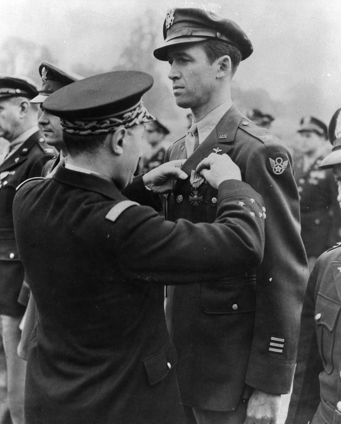 Lieutenant General Henri Valin, Chief of Staff, French Air Force, awards the Croix de Guerre avec Palme to Colonel James M. Stewart, USAAF, 1945. (U.S. Air Force)