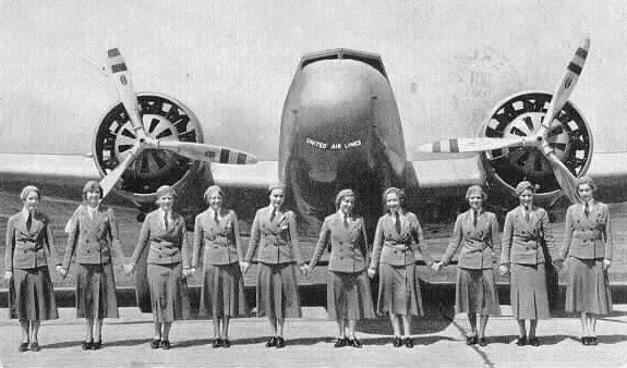 A contemporary photo post card depicts United Air Lines stewardesses with a Boeing Model 247 airliner. The post mark on the reverse side is faintly visible.