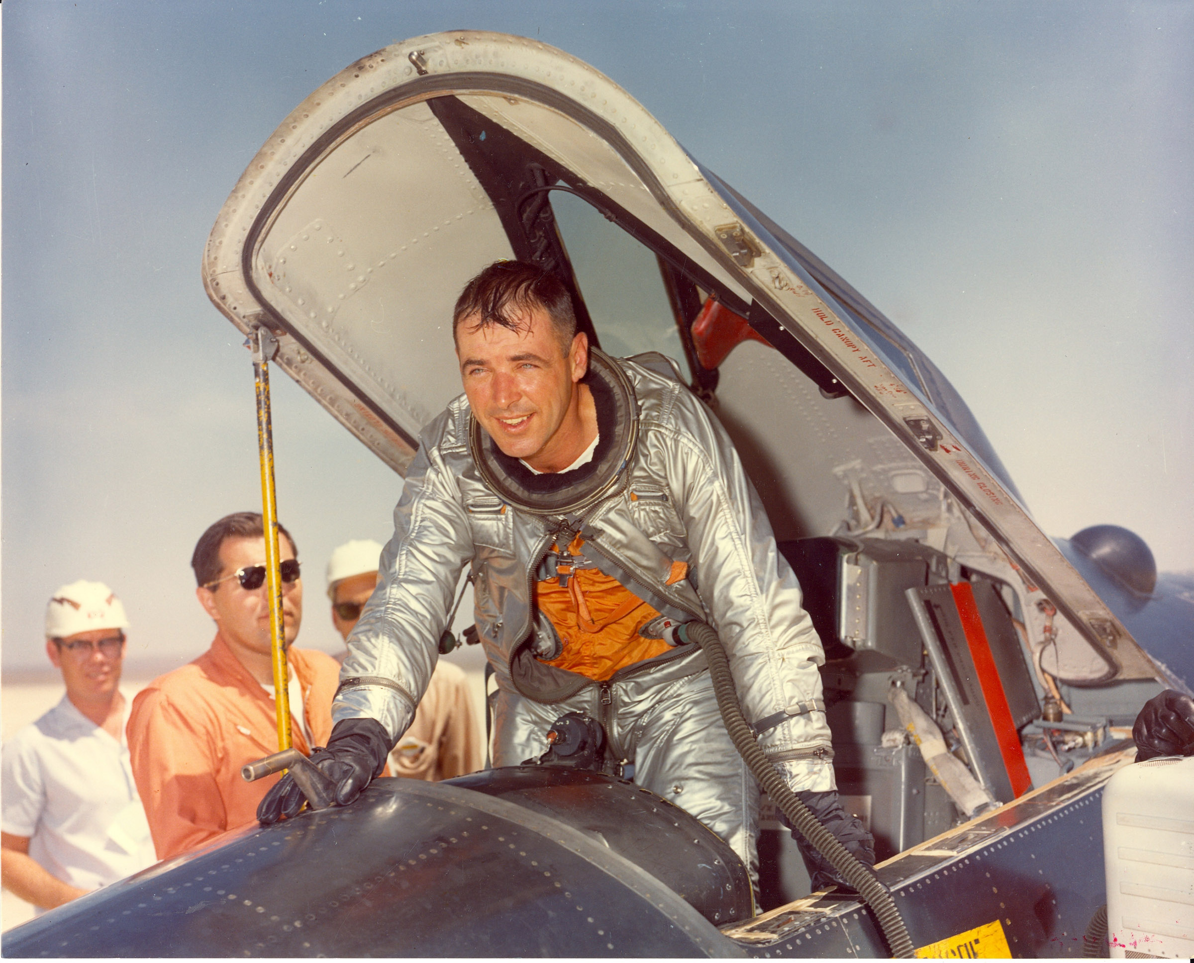 Major Robert M. White exits the cockpit of an X-15 at Edwards AFB. White is wearing a David Clark Co. MC-2 full-pressure suit. (U.S. Air Force)