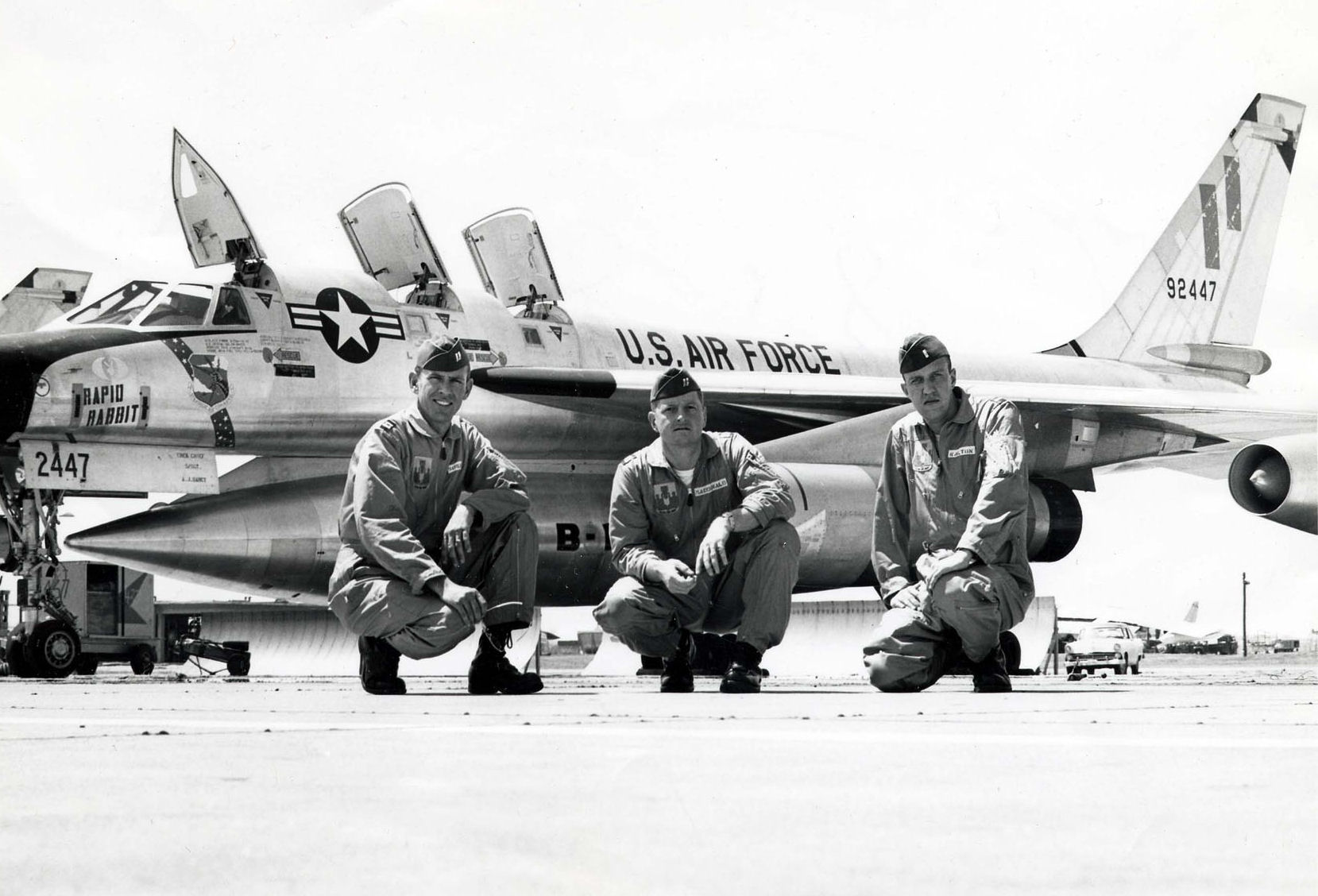 The Bendix and macKay Trophy-winning flight crew of Operation Heat Rise, left to right, Captain Robert G. Sower, pilot; Captain Robert MacDonald, navigator; First Lieutenent John Walton, Defense Systems. behind them is another B-58A, 59-2447.(U.S. Air Force)