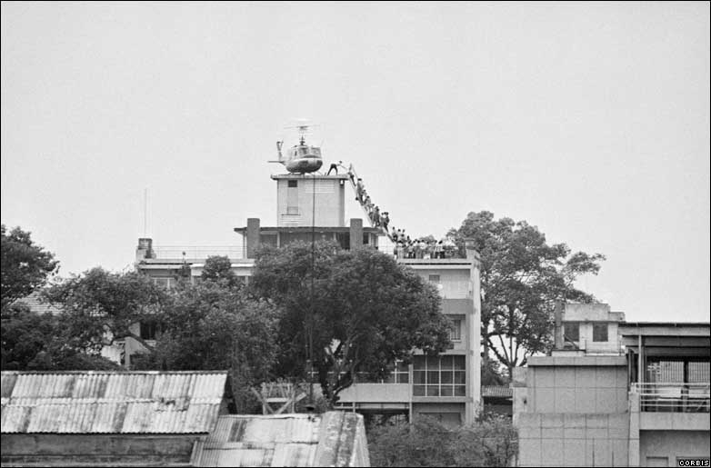 Air America helicopter evacuates refugees during the Fall of Saigon. (Hubert van Es)