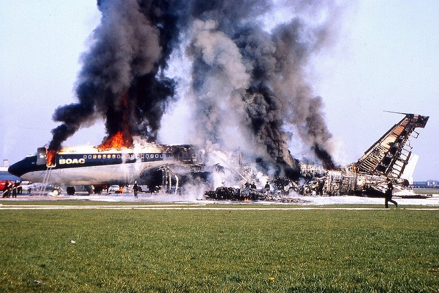BOAC Flight 712, a Boeing 707-465, G-ARWE, burning on the runway at Heathrow, 8 April 1968.
