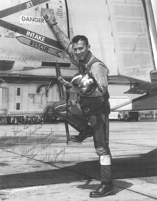 Commander John W. Young, United States Navy, with a McDonnell F4H-1 Phantom II. (U.S. Navy)