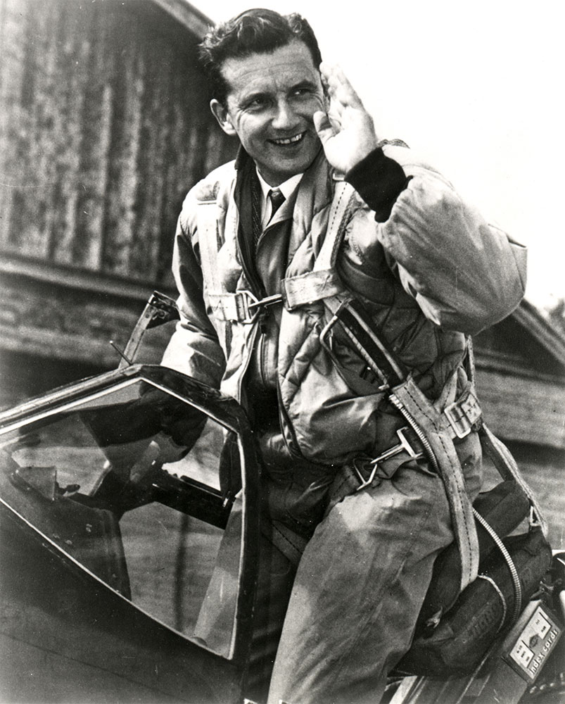 Charles F. Blair, Jr., standing in the cocpit of his North American Aviation P-51C Mustang, N1202, Excalibur III, 1951. (National Air and Space Museum, Smithsonian Institution.)