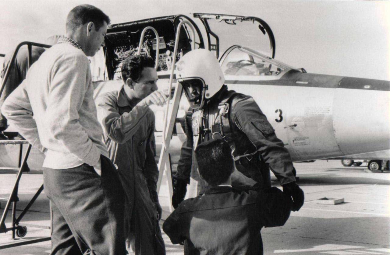 MAJ Howard C. Johnson prepares for his record flight, with Lockheed test pilot Willam M. ("Bill") Park (center) and Jack Holliman. YF-104A Starfighter 55-2957 is in the background. (Lockheed)