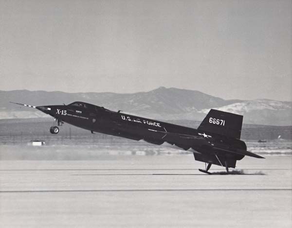 This photograph shows the second North American Aviation X-15A, 56-6671, flaring to land on Rogers Dry Lake, Edwards Air Force Base, California The rear skids are just touching down. The white patches on the aircraft's belly is frost from residual cryogenic propellants remaining in its tanks. (U.S. Air Force)
