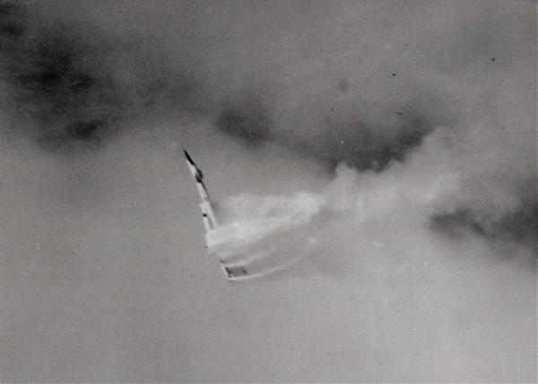 The B-70 is out of control and going down in this photograph. Fuel is spraying out of damaged tanks. (U.S. Air Force)