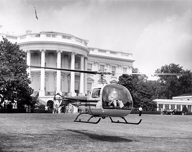 Bell H-13J 57-2729, flown by Major Barret, with President eisenhower and a Secret Service agent, departs the White House for teh first time, 2:08 p.m., 12 July 1957. (The White House) 