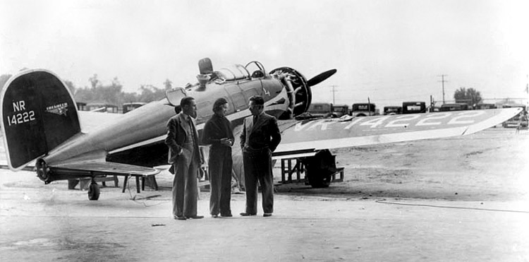 Billy Parker, Laura Ingalls and Wiley Post at the 1935 National Air Races. Ingall's Lockheed Orion 9D, NR14222, Auto da Fé, has its engine cowling removed for maintenance. (Monash University)