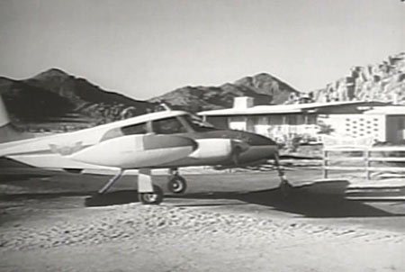 This still image from the television series, "Sky King", shows teh Songbird parked at "the Flying Crown Ranch", actually, a location near Apple Valley, California.