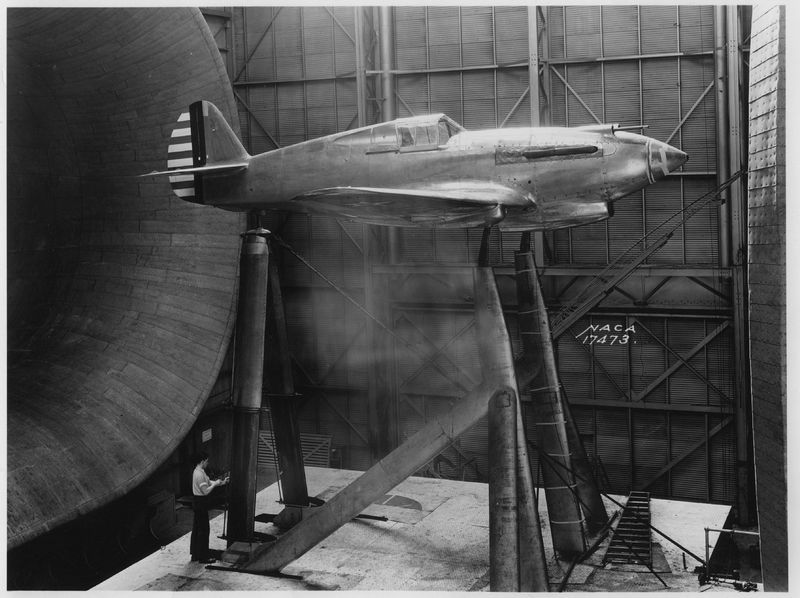 Curtiss XP-40 prototype in the NACA wind tunnel at Langley Field, Virginia, 24 April 1939. The technician at the lower left of the photograph provides scale. (NASA)