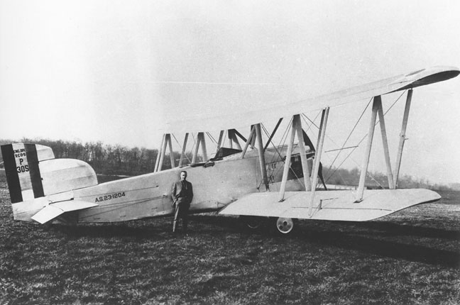 Liuetenant John A. Macready, USAAS, stands in front of the Engineering Division-built XCO-5. (U.S. Air Force)