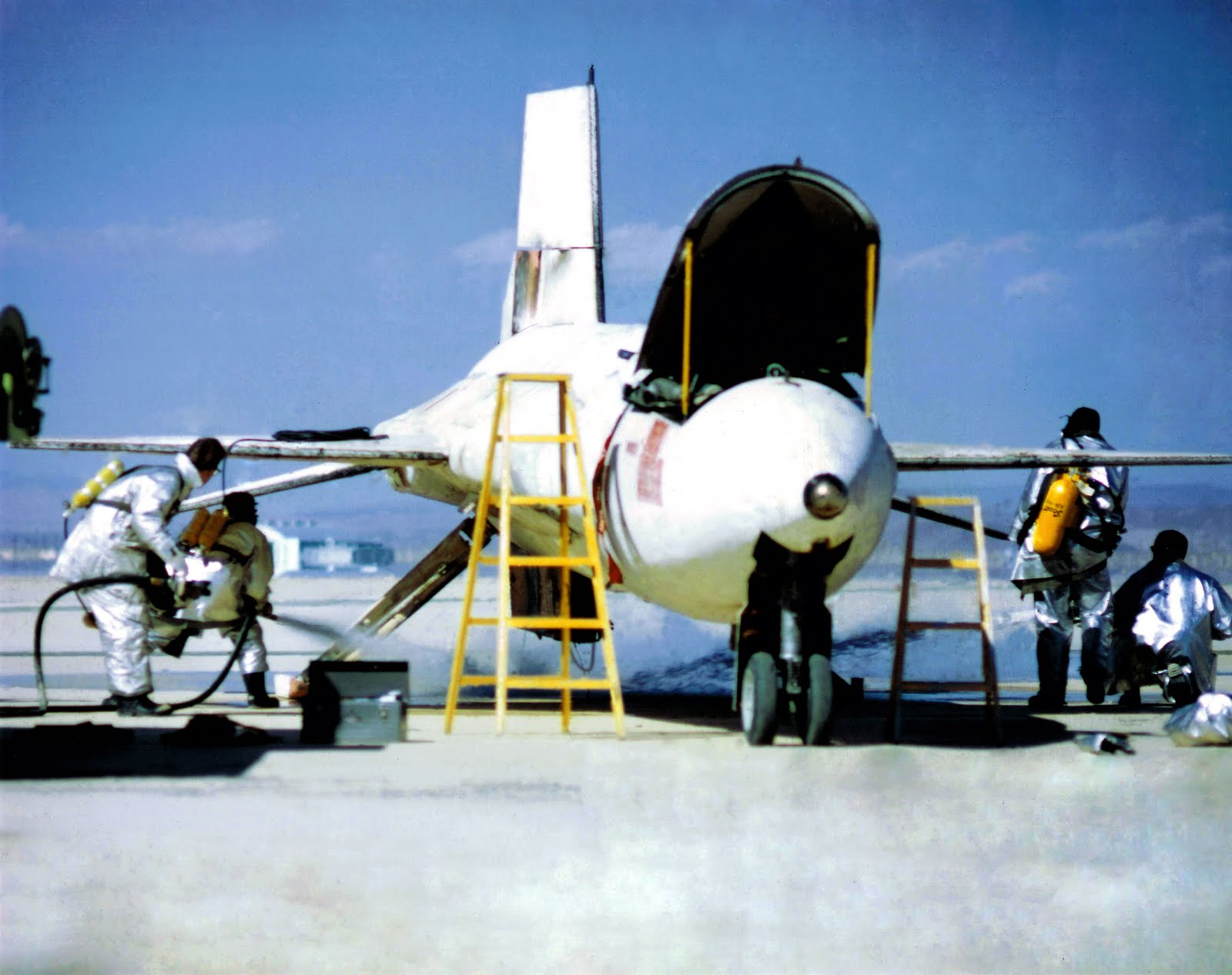 Firefighters cool down the ventral fin of the North American Aviation X-15A-2 56-6671 after its last landing on Rogers Dry Lake, 3 October 1967.(U.S. Air Force)