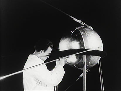 An unidentified engineer with Sputnik 1.
