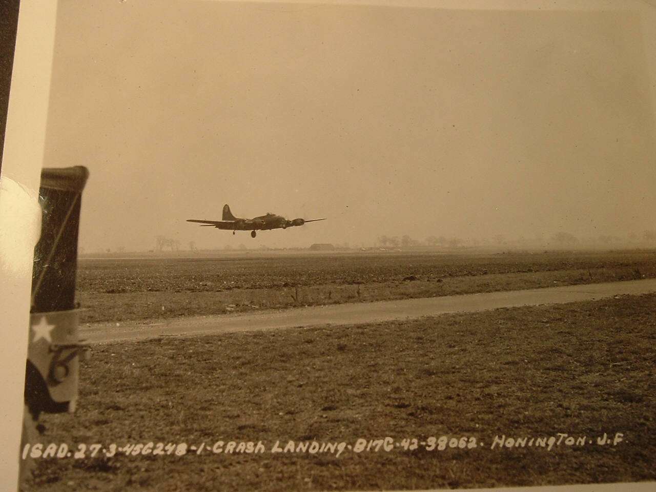 B-17G-25-DL 42-38052, with one main gear extended, just before crash landing at B-53, 1340 hours, 27 March 1945. (U.S. Air Force)
