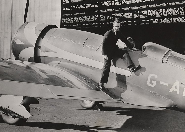 Sir Charles Edward Kingsford Smith, MC, AFC, with the Lady Southern Cross at Croydon, 17 October 1935. The airplane's registration has been changed to G-ADUS.