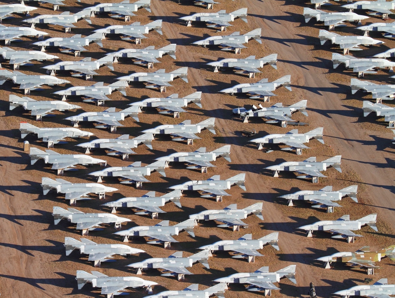 Row after row of F-4 Phantom II fighters in storage at Davis-Monthan AFB.