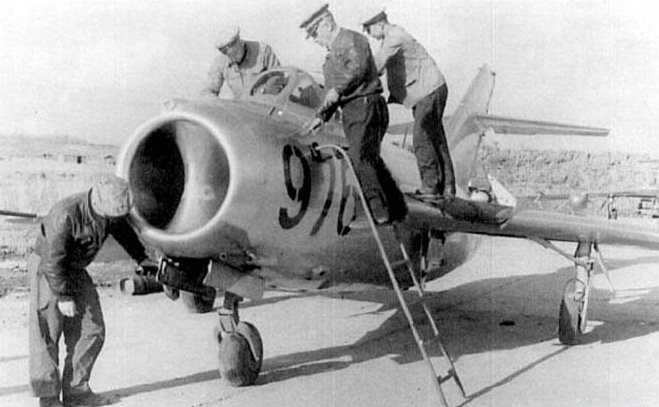 Russian technicians service a MiG-15bis o fteh 351st IAP at Antung Air Base, China, mid-1952. (Unattributed)