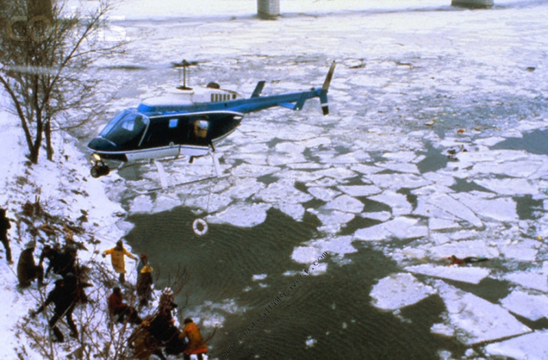 U.S. PArk Police "Eagle 1", a bell 206L-1 LongRanger II, N22PP, hovers over the bank of the Potomac River, 13 January 1982.