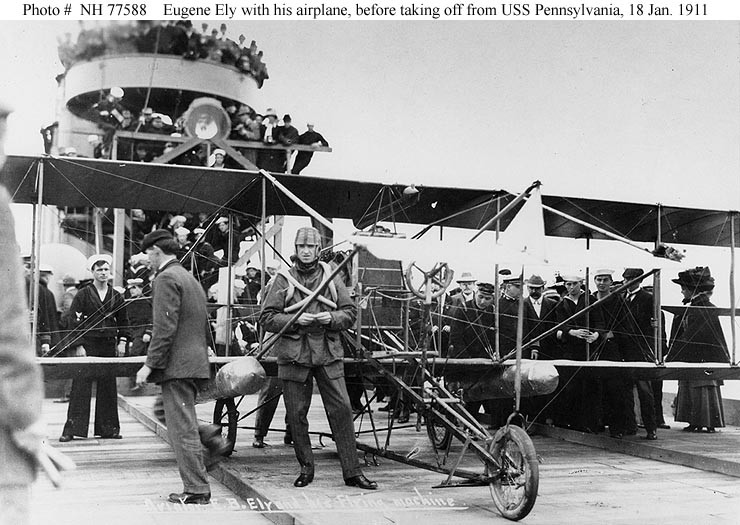 Eugene Ely with his Curtiss pusher aboard USS Pennsylvania, shortly before taking off, 18 January 1911. (U.S. Navy)