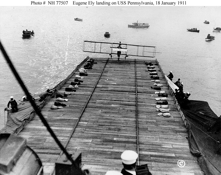 Eugene B. Ely landing his Curtiss pusher aboard USS Pennsylvania (ACR-4) at anchor in San Francisco Bay, 18 January 1911. (U.S. Navy)