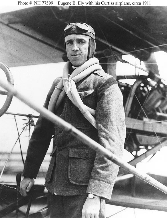 Eugene B. Ely with his Curtiss pusher. He is wearing an improvised life vest made of bicycle tire inner tubes. (U.S. Navy