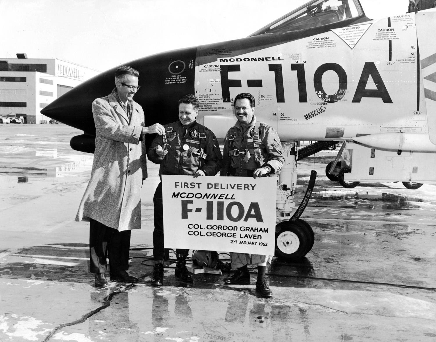 Sanford N. ("Sandy") McDonnell hands over the keys to the first F-110A Spectre to the United States Air Force, St. Louis, Missouri, 24 January 1962. (McDonnell Aircraft Corporation)