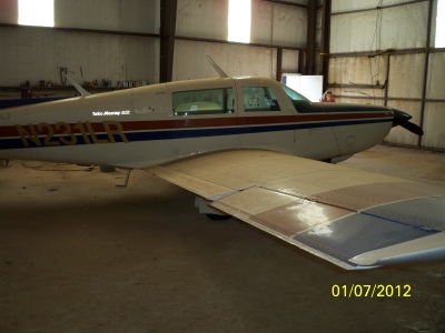 The transcontinental speed record Mooney 231, N231LR, covered with dust in a hangar at Clovis Municipal Airport, New Mexico, 7 January 2012. (D&D Aircraft)
