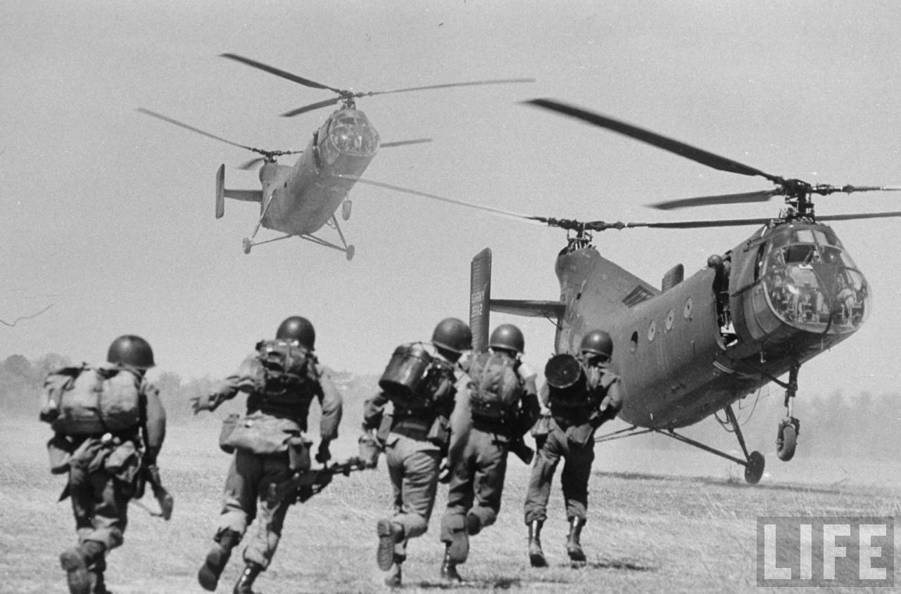 ARVN soldiers run to board U.S. Army CH-21C Shawnee helicopters. (LIFE Magazine)