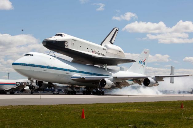 35 years, 2 months, 10 days after their first combination flight, the prototype Space Shuttle Orbiter Enterprise (OV-101) and Shuttle Carrier Aircraft NASA 905, touch down together for the last time, at John F. Kennedy International Airport, 11;23 a.m., EST, 27 April 2012. (AP)
