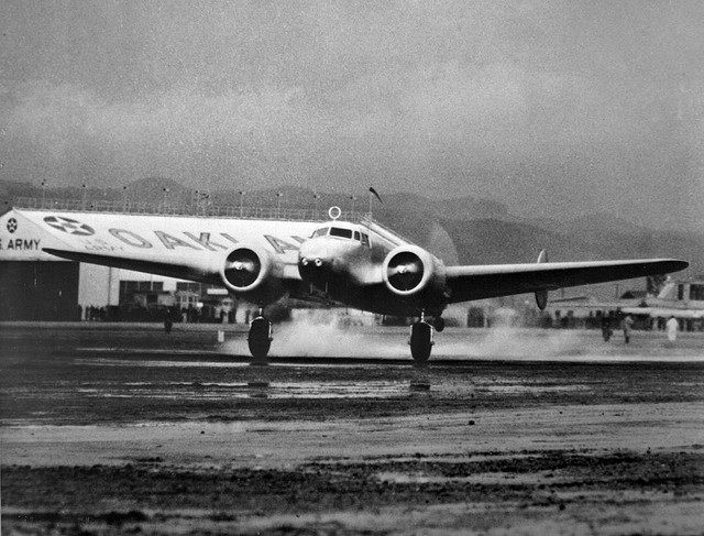 Amelia Earhart's Lockheed Electra 10-E, taking off from Oakland Airport, 1637 hours, 17 March 1937. The tail wheel has just lifted off the runway. 