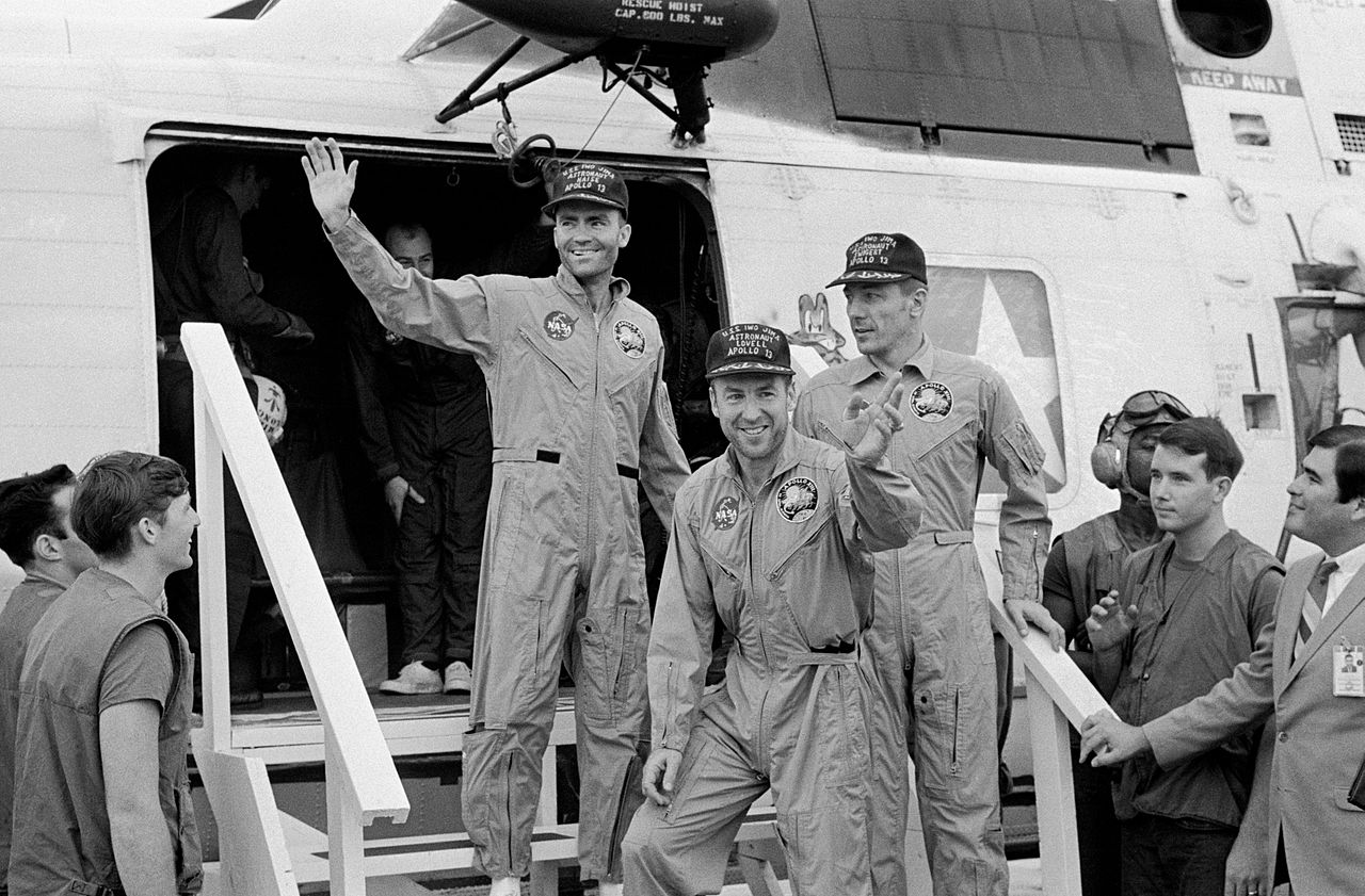 The flight crew of Apollo 13 disembark the Sikorsky SH-3D Sea King helicopter, Bu. No. 152711, Number 66, aboard USS Iwo Jima (LPH-2), at approximately 18:52 UTC, 17 April 1969. In the center of the image, from left to right, are astronauts Fred Haise, Jim Lovell and Jack Swigert. (NASA)