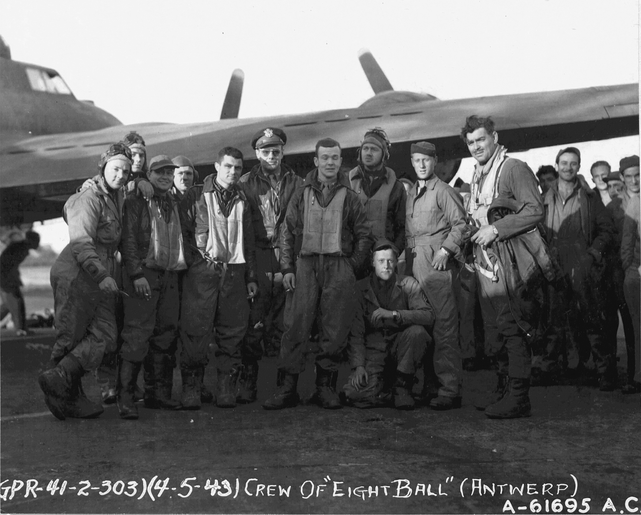 The crew of The 8 Ball Mk II, a Boeing B-17F-27-BO Flying Fortress, serial number 41-24635, 359th Bombardment Squadron, 303rd Bombardment Group (Heavy), following an attack against Antwerp, Belgium, 5 April 1943. (U.S. Air Force)