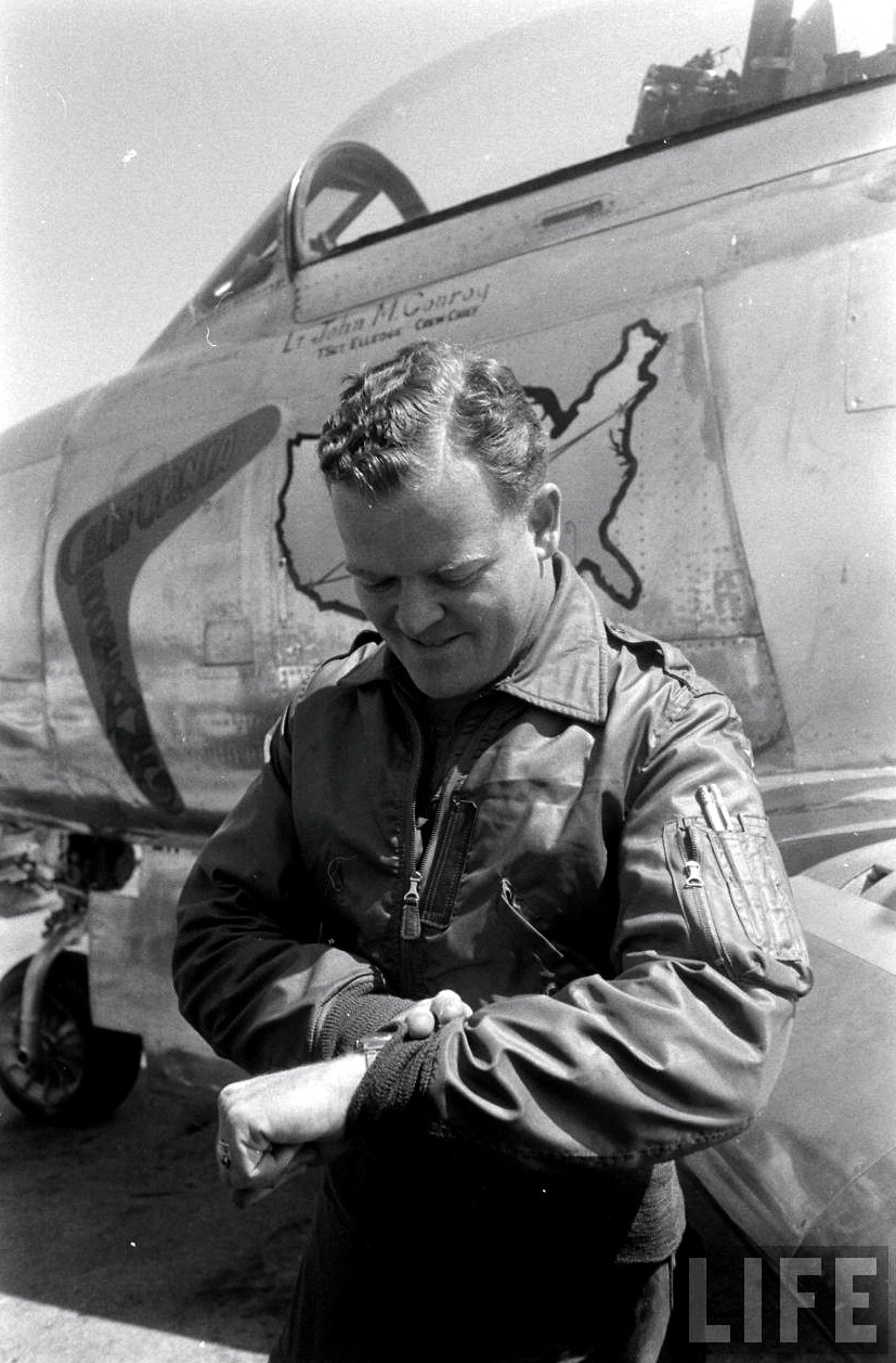 1st Lieutenant John M. Conroy, 115th Fighter Interceptor Squadron, California Air National Guard, checks the time after arriving back at the point of departure, 21 May 1955. (LIFE Magazine via Jet Pilot Overseas)