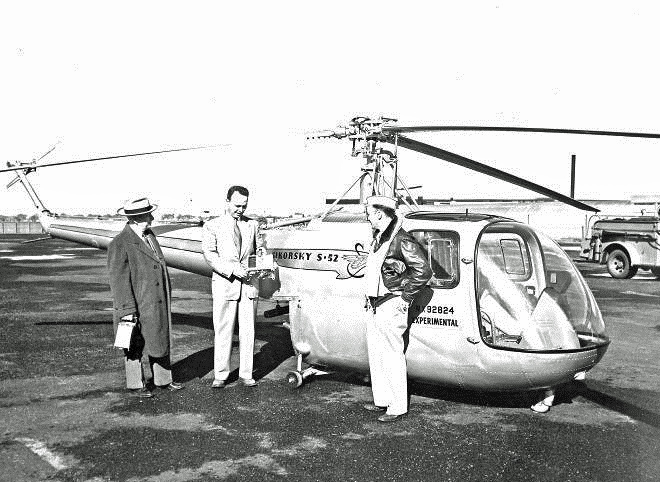 Captain Hubert D. Gaddis, USAAF with teh Sikorsky S-51-1. NAA representatives check baraographs. (Sikorsky Archives)
