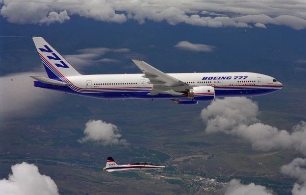 Boeing 777-200 N7771, line number WA001, on its first flight, 12 June 1994. The chase plane is a Northrop T-38A Talon. (AP)