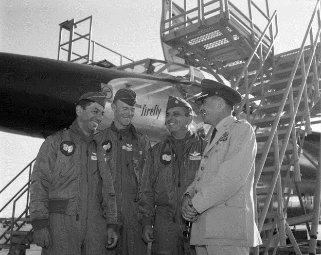 Major Eugene Moses, Navigator, 1st Lieutenant David F. Dickerson, Defensive Systems Officer, and Major Elmer E. Murphy, Aircraft Commander, with Colonel James K. Johnson, stand in front of the Convair B-58, The Firefly, 11 May 1961. (University of North Texas Libraries)