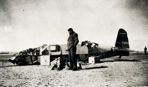 Antoine de Saint-Exupéry stands next to th ewreck of his Caudron C.630 Simoun, F-ANRY, in the Sahara