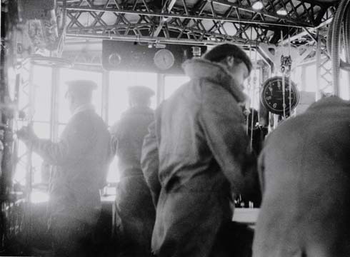 Crewmen working in the forward control car of R34 during the Atlantic crossing, July 1918. (National Museums Scotland)