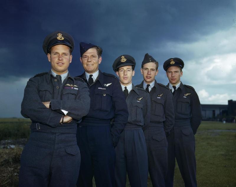 Wing Commander Guy Gibson with members of his crew. Left to right: Wing Commander Guy Gibson, VC, DSO and Bar, DFC and Bar; Pilot Officer P M Spafford, bomb aimer; Flight Lieutenant R E G Hutchinson, wireless operator; Pilot Officer G A Deering and Flying Officer H T Taerum, gunners. (Imperial War Museum TR 1127)