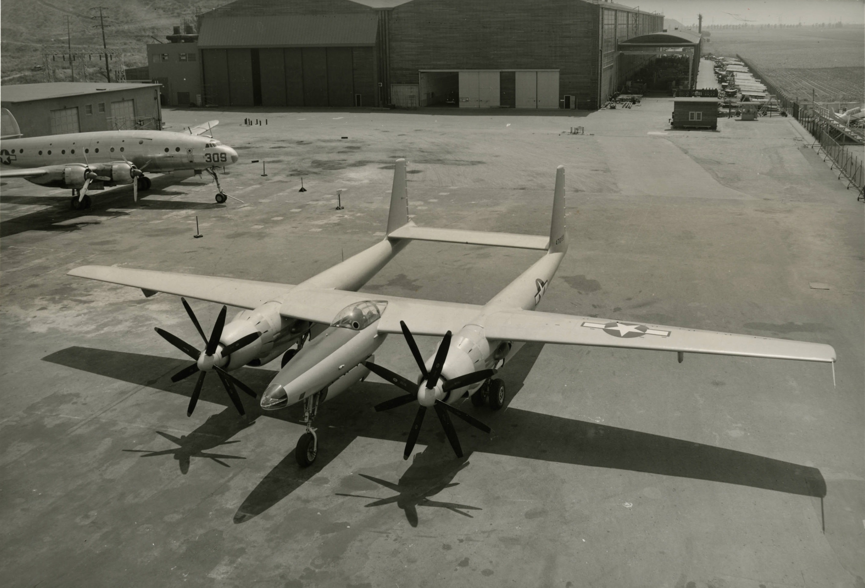 Hughes XF-11 44-70155 at Culver City, California, 7 July 1946. A Lockheed C-69 Constellation is in the background. (University of Nevada, Las Vegas Libraries)