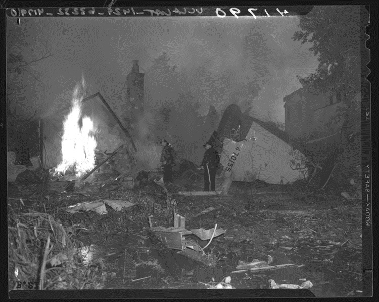 Burning wreckage of Hughes' prototype XF-11 in the yard at 808 N. Whittier Street, Beverly Hills, California. (Unattributed)