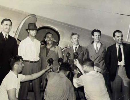 The flight crew of Horad Hughes around-the-world flight, left to right, Hughes, 