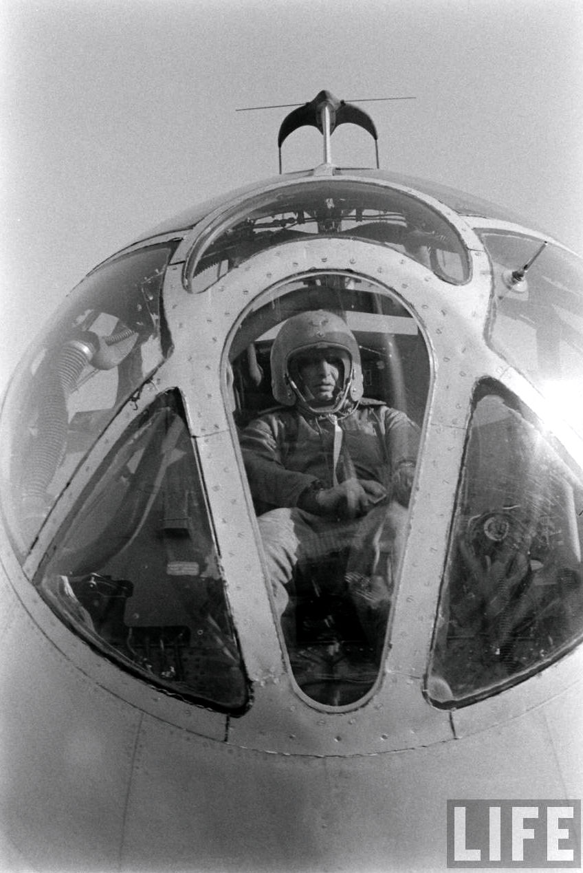 Lieutenant Colonel Frank K. Everest, USAF, rides in the nose of a Boeing EB-50D Superfortress mothership before a rocketplane flight. He is wearing a David Clark Co. capstan-type partial pressure suit with a K-1 helmet. This scene was portrayed by William Holden in Toward The Unknown". (LIFE Magazine via jet Pilot Overseas)