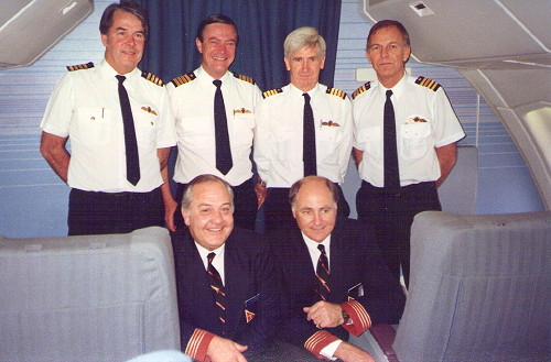 The crew of Qantas Flight 741. Front row, left to right: FSD David Cohen, FSD Mal Callender. Back row, left to right: Captain Ray Heiniger, Captain David Massey-Greene, Captain George Lindeman, Captain Rob Greenop.