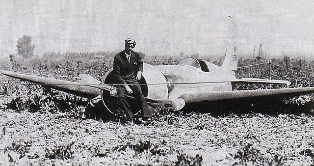 Howard Hughes with his H-1, NR258Y, in a been field near Santa Ana, California, 13 September 1935.