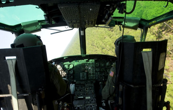 Cockpit of a U.S. Air Force/Bell UH-1N Iroquois during a 60° bank. (A1C Nigel Sandridge, U.S. Air Force)